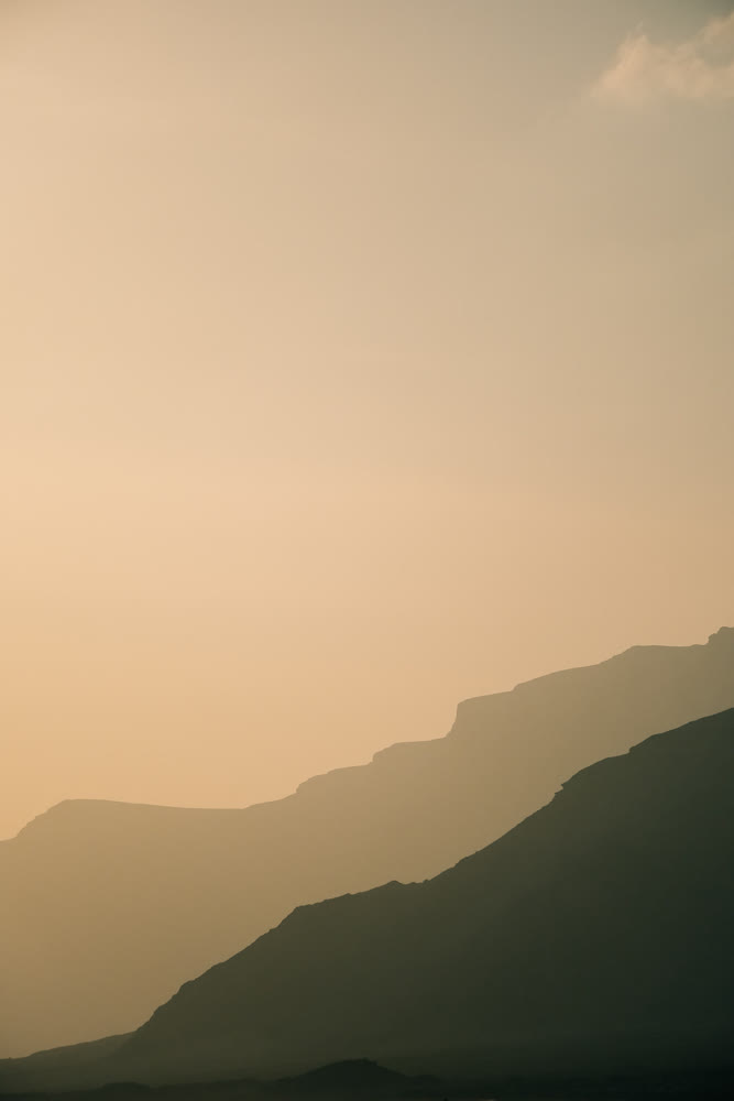 Calm sky with layered peaks. Contemporary interior visual with soft gradients and atmospheric depth