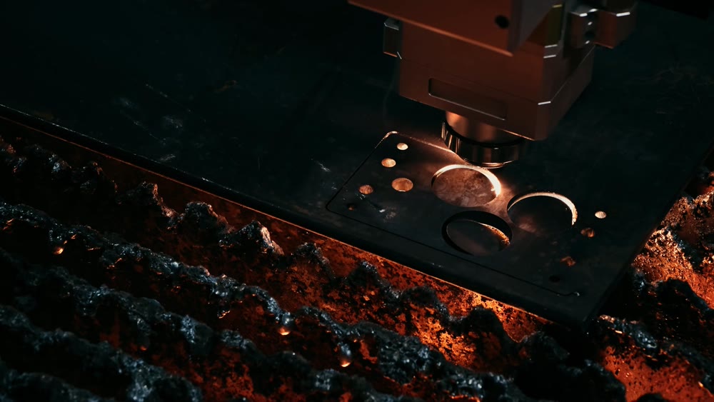Heavyduty fabrication environment showcasing plasma cutter creating circular shapes in steel surface